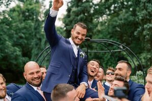 Groomsmen Lifting up Groom and Cheering