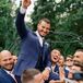 Groomsmen Lifting up Groom and Cheering