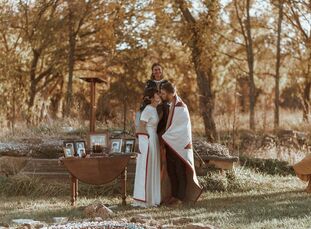 Past was present at the wedding of Melissa and Dane, held at a historic general store. During the ceremony, they lit a candle at an altar of ancestral