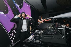 Groom in a Black Tuxedo and Turban Plays DJ, Bride Shoots Smoke at Reception