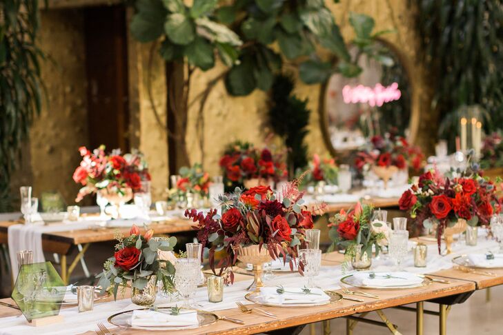 Rustic Dining Tables with Red and Gold Centerpieces