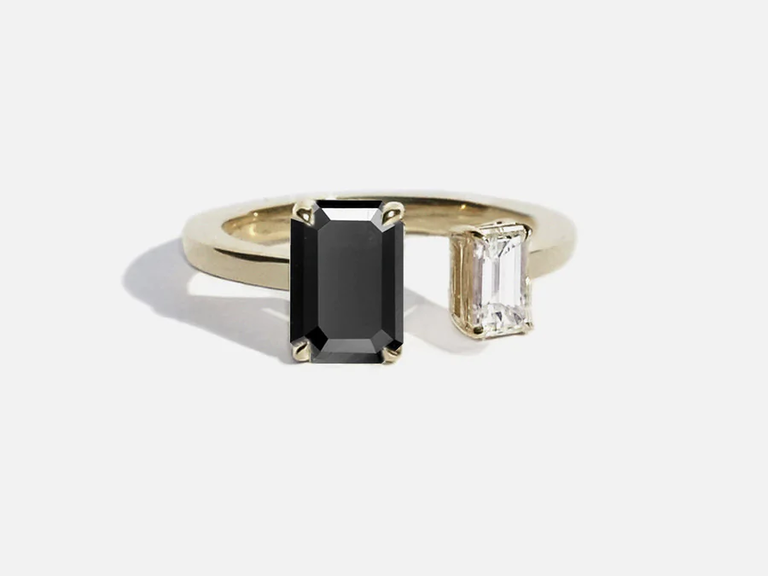 Nothing is more modern than this elegant two-stone diamond engagement ring in black and white.