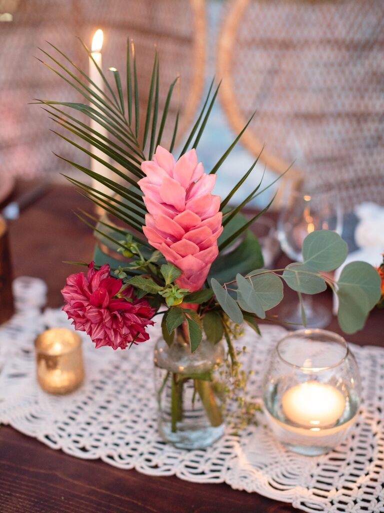 A fern and pale pink floral arrangement.