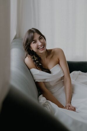 Bride With Braid With Fresh Flowers and Light Makeup Look Smiling Getting Ready