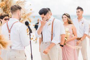 Grooms Exchanging Wedding Vows on the Beach with Wedding Party