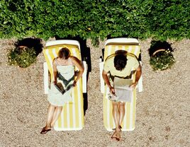 Couple reading on their honeymoon. 