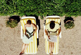 Couple reading on their honeymoon. 