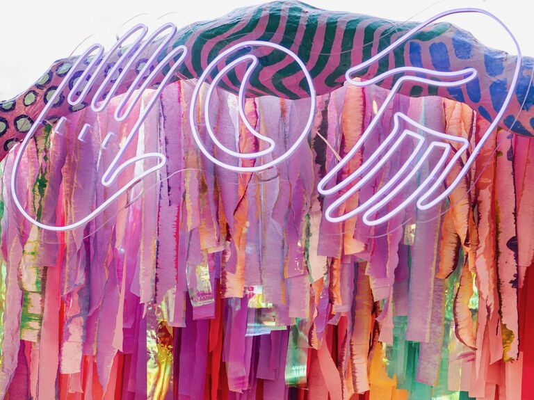 A modern summer-toned neon sign.