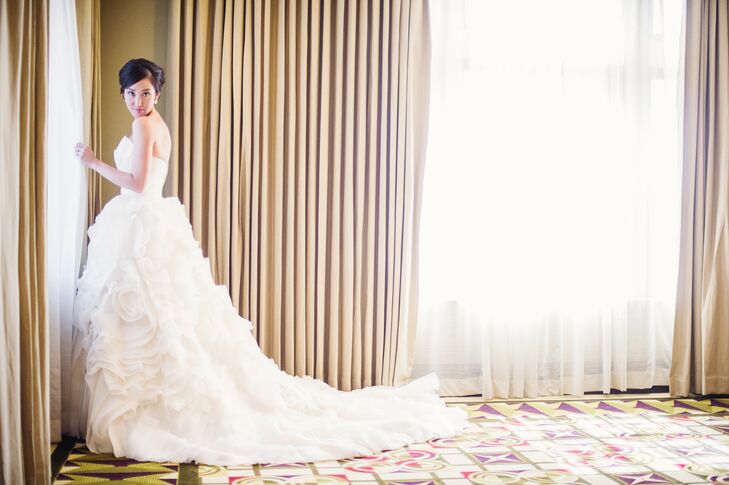 “I always wanted a dramatic dress but it had to be simple at the same time,” Christine says. “I finally found the perfect balance of drama and simplicity when I found this amazing Maggie Sottero wedding gown. It had the dramatics in the bottom with flowing laters of chiffon, yet a simple and modern asymmetrical sweetheart neckline.”
