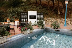 Couple's Custom Logo, Initials as Floats in Fountain Pool at Tranquil Garden Reception