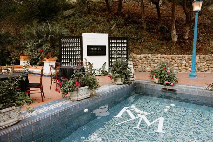 Couple's Custom Logo, Initials as Floats in Fountain Pool at Tranquil Garden Reception
