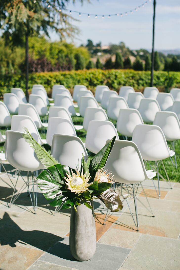 White Eames-style chairs were used at the ceremony and doubled as seating at the reception at Scott's parents' home in San Rafael, California.