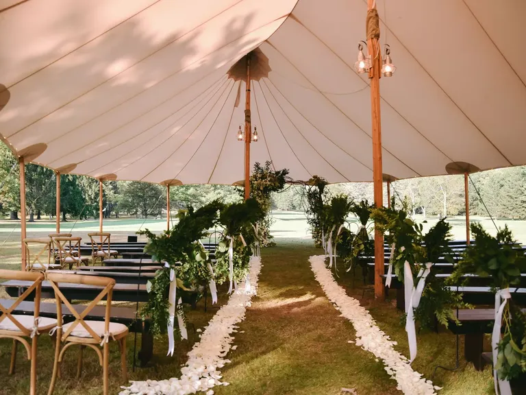 Flower Petals Lined This Tent Wedding Ceremony