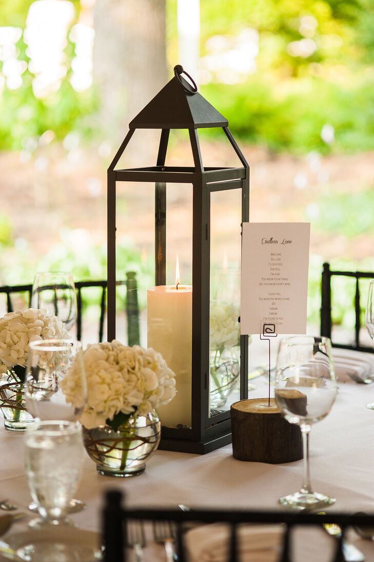 To achieve their desire for simple, modern and timeless decor, the couple chose lantern and candle centerpieces.