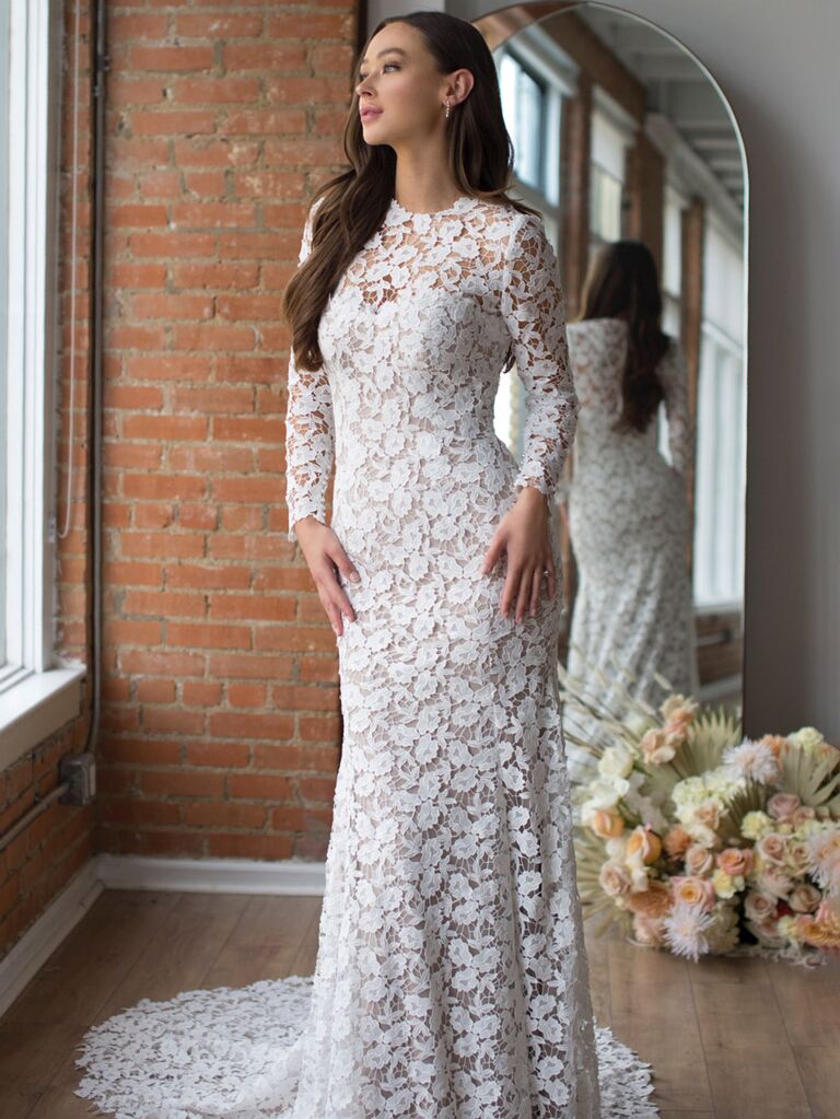 watters white lace high neck wedding dress with lace mesh long sleeves allover lace and form fitting lace flowy skirt