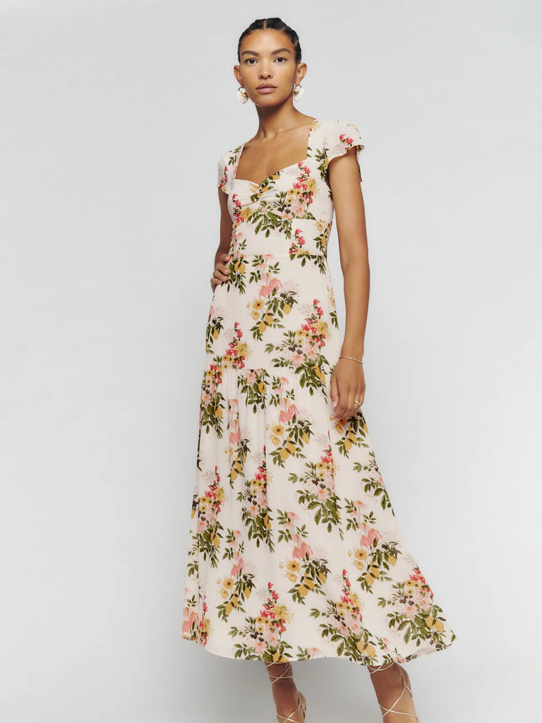 A model wears this ankle-length floral engagement dress.