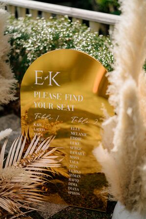 Seating Chart On Gold, Reflective Sign With Calligraphy, Pampas Grass Surrounding