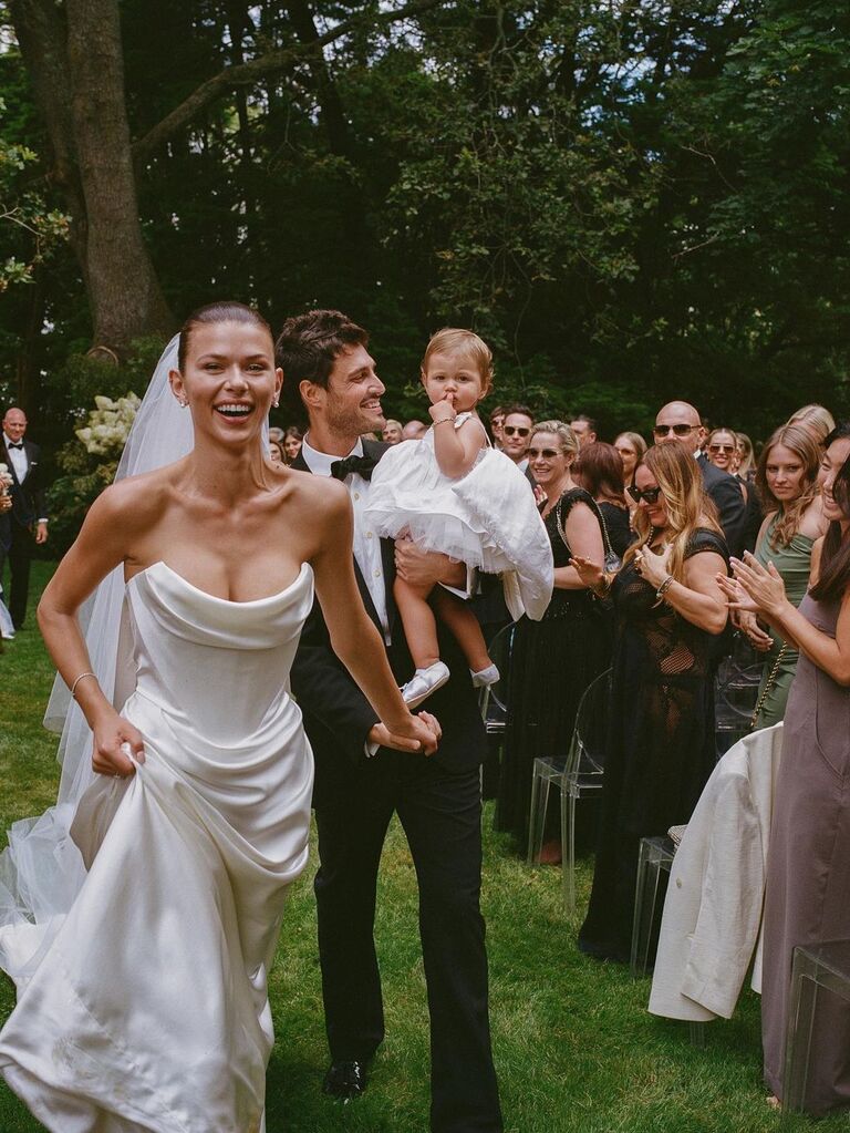 Georgia Fowler walks down the aisle at her wedding. 