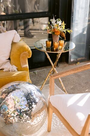Disco Ball and Yellow Velvet Sofa