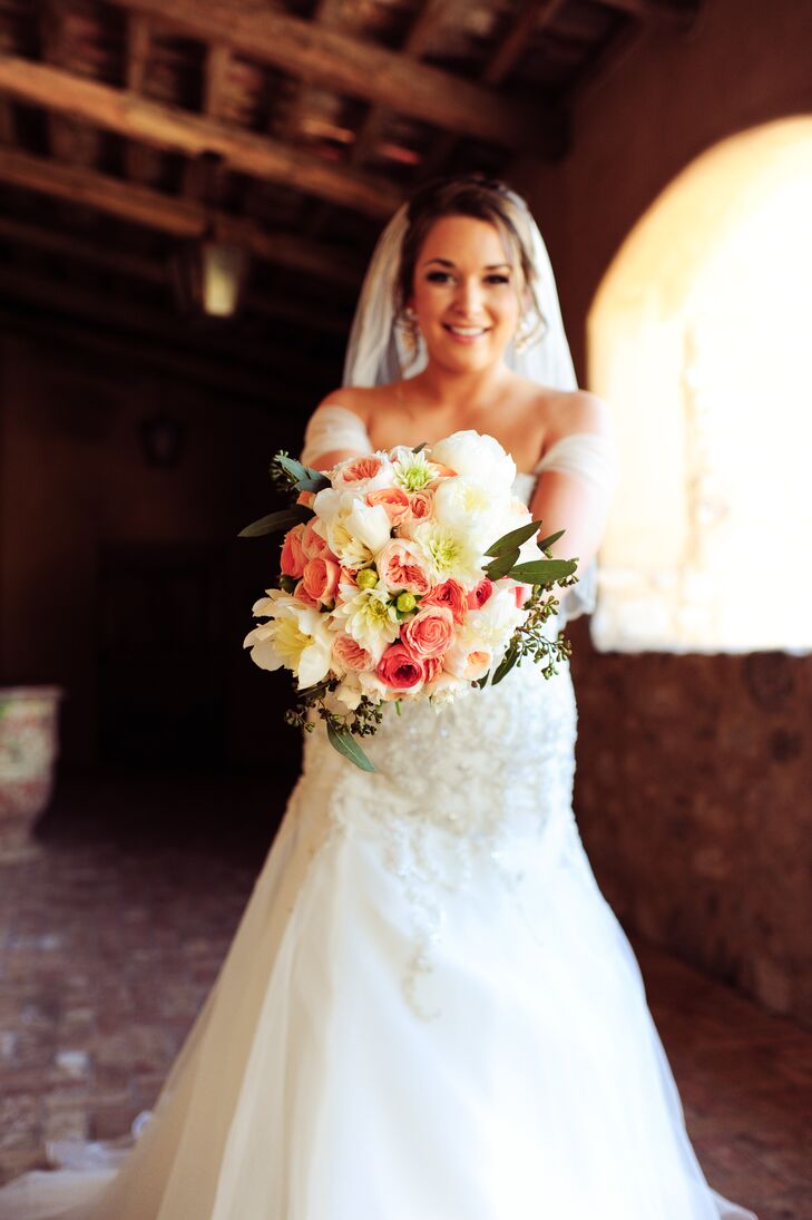Nicole's textured bouquet included Juliet garden roses, ivory dahlias, cinnamon roses, coral ranunculus and soft greenery. Her florist, Butterfly Petals, tied in some native Arizona flowers with some of the more big and bountiful varieties Nicole envisioned.
