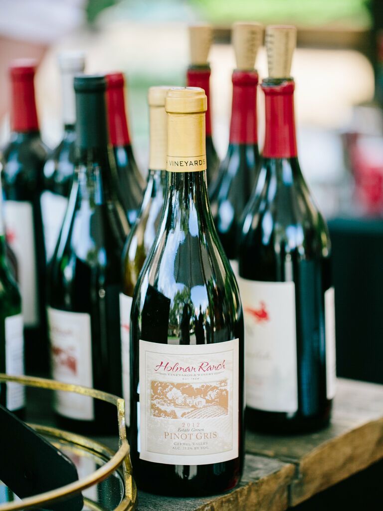 Bottles of red wine displayed at a wedding. 