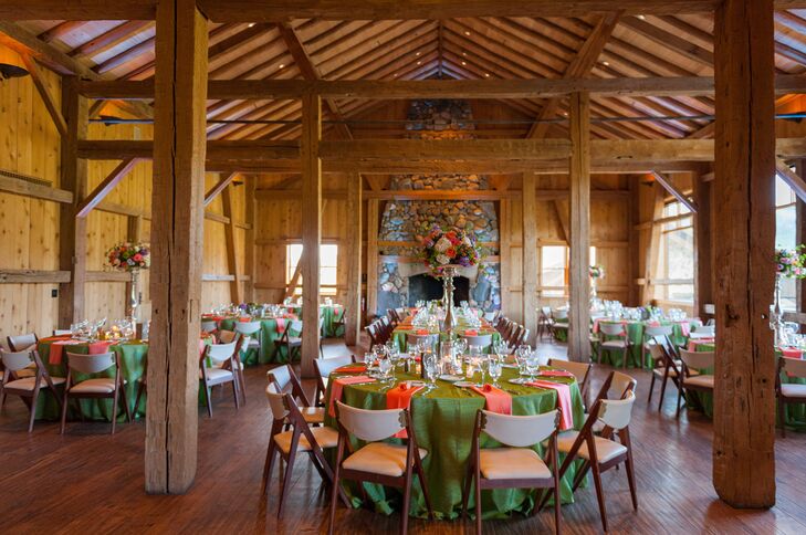 Katie and Haydn decorated their reception with a mix of tall and short centerpieces to add some dimension to the room and green and orange linens for a pop of color.