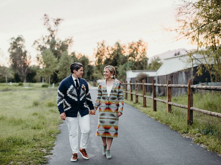 Brides wearing bohemian tribal-printed wedding outfits