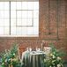 Sweetheart Table with Patterned Linens and Classic Flower Arrangements