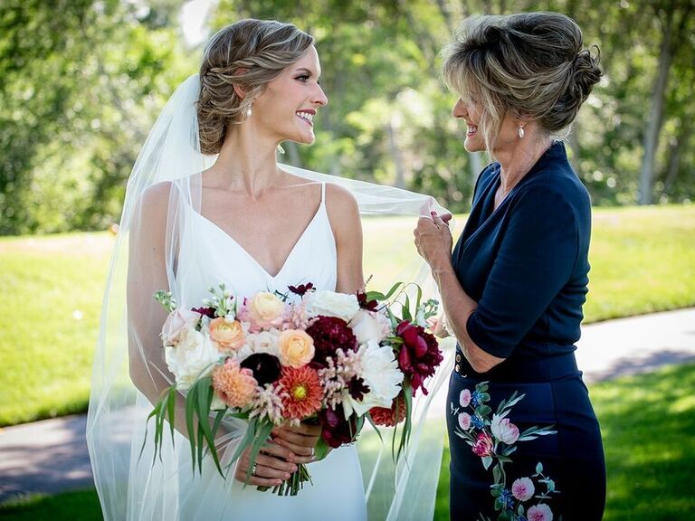 Bride smiles with her mother for her Denver wedding. 
