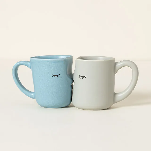 Kissing coffee mugs from Uncommon Goods for the best 15th wedding anniversary gift