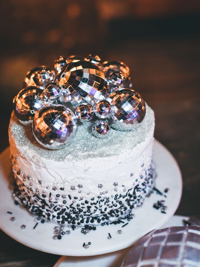 unique one tier wedding cake decorated with silver disco balls and silver metallic sprinkles