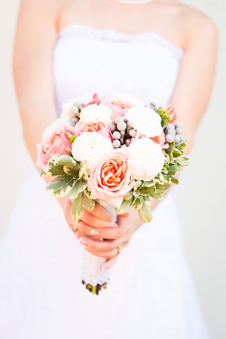 Micaela held a bouquet of Ivory and pink roses accented with greens and hypericum berries.