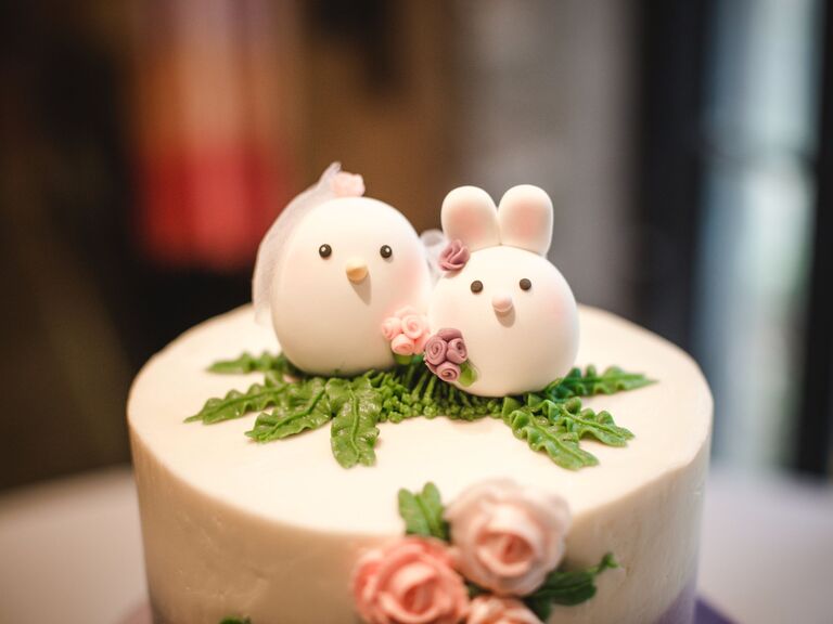 marzipan wedding cake topper with bird and bunny figurines
