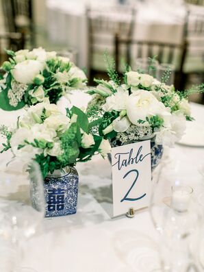 Blue-and-White Chinoiserie Vases with White Roses and Table Numbers at Wedding Reception Tables