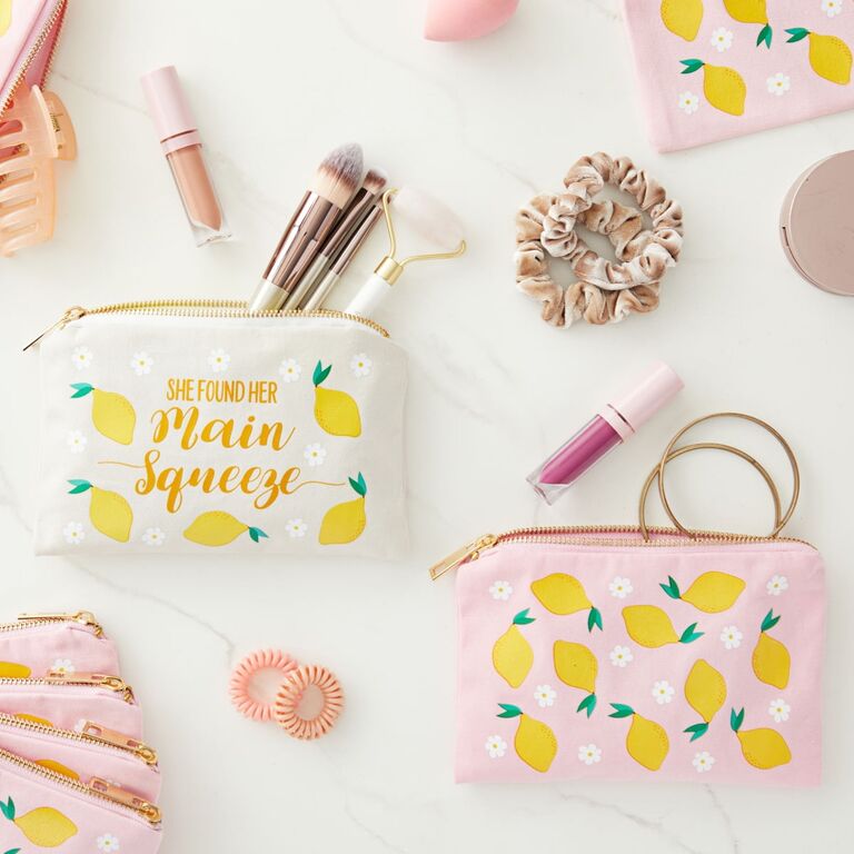 A set of white and pink cosmetic bags with lemons and daisies from Walmart