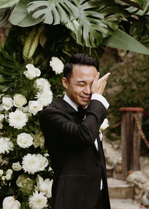 Groom in Classic Black Tuxedo Wiping Tears From His Eyes From Crying