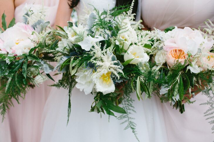 The bridesmaid bouquets echoed Nina's gorgeous arrangement and included white roses, peach garden roses, white astilbes, white sweet peas, blush peonies, olive branches, green plumosa, jasmine vine and dusty miller tied with a pale blush ribbon.