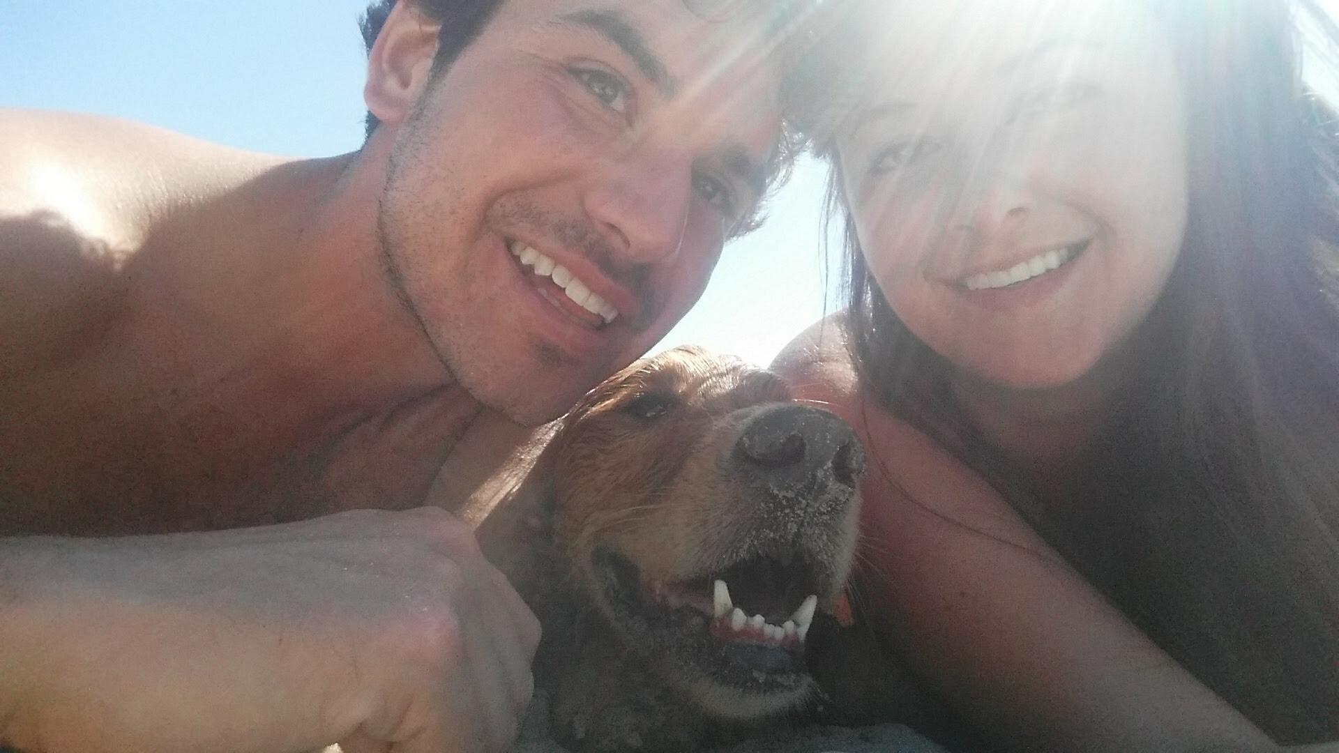 It all began on July 19th, 2016, at the most romantic location imaginable: Avila Dog Beach—where the sand is soft, the waves are salty, and everyone’s covered in fur and drool. Michelle met Joel... and instantly fell for someone else. Her name was Kaia, a 4-year-old golden retriever with a goofy grin, a wagging tail, and immediate main character energy. Joel was there too. He came with the leash.
As it turned out, Joel wasn’t so bad himself—he played guitar, loved to explore new places, knew where to find the best fish tacos (Ruddell's!), and didn’t mind when Michelle got more excited about seeing Kaia than him. What started as a simple beach day quickly turned into a whirlwind of bonfires, wine tastings and concerts as they melded into each other’s friend groups. Within that month, they were seeing their first live shows together, HoneyHoney at SLO Brew and Sean Hayes at Castoro Cellars. Fall found them wandering through pumpkin patches with the pups, and day-tripping to Cambria hiking through Fiscalini Ranch Preserve. They even bonded over their love for animals at a Zoo to You wine tasting in Paso Robles where they held baby alligators—romance at its peak! Yes, Michelle asked if they could keep one, one of Joel's first glimpses into her enduring compassion for all animals. That first holiday season was a true test of endurance: Michelle joined Joel’s family for Thanksgiving in the Sierras, where she met his parents Betty and Bill and sister Kyla. Thanksgiving was followed by a Red Rock Canyon hike in the Mojave Desert, and their first camping trip to Kirk Creek in Big Sur in December - freezing, adorable, character-building (Michelle survived!). Then it was up the coast to the Bay Area to celebrate Christmas with Michelle’s family, where Joel met her mother Pam, sister Lauren and brother-in-law Michael. Then it was back to SLO for an unforgettable New Year’s Eve at the Fremont Theater, dancing the night away to Donovan Frankenreiter.