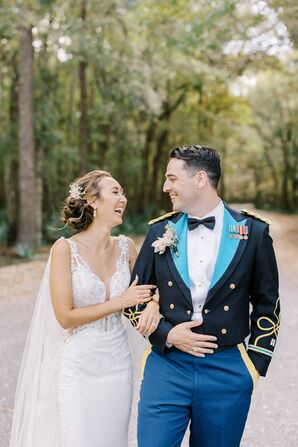 Bride in Fitted Gown With Sheer Cape and Groom in Military "Mess Dress" Walking