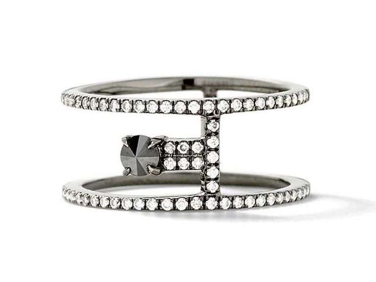 Black diamond engagement ring in between two pavé bands