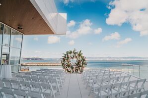 Rooftop Wedding Ceremony at Chase Center in San Francisco With Tropical Arch