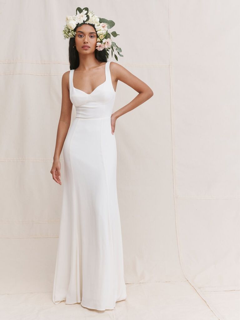Model wears a white Reformation gown. 