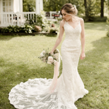 bride in Shelby wedding dress holding bouquet