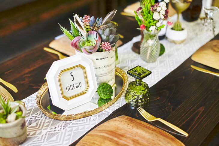 Tables were set with depression glassware that Angela found at markets and thrift stores, along with brass candlesticks, wooden candlesticks and funky brass figurines. Angela made the table runners herself out of Aztec lace fabric.