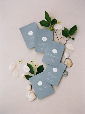 Delicate, Seashell-Themed Escort Cards in Pale Blue for South of France Reception