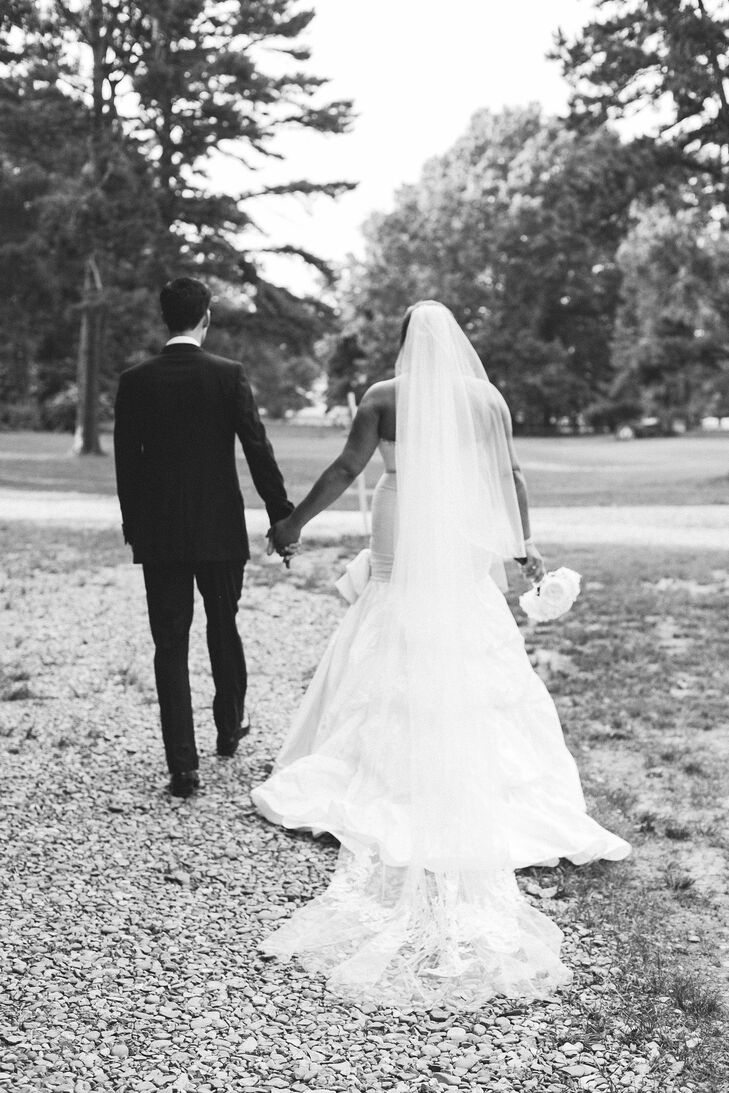 Nikki wore a strapless buttercream Yumi Katsura wedding dress with a Vera Wang veil from Bridal Impressions in New York City. Scott wore a Brooks Brothers tuxedo.
