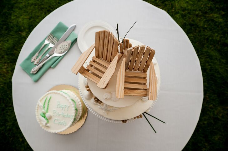 The bride and grown chose mini wooden lawn chairs for their cake topper to play up the nautical, Cape Cod theme of the wedding. The groom also made a custom cornhole game for his guests to play during the reception.