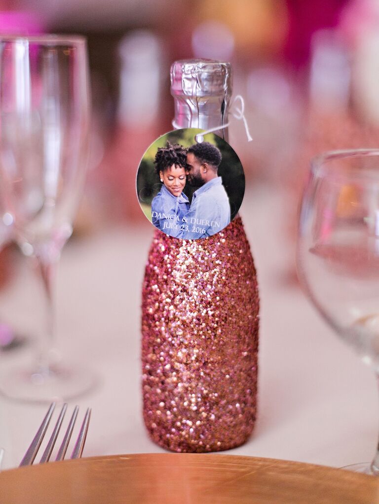 Mini glitter champagne bottle wedding favors with photo gift tags