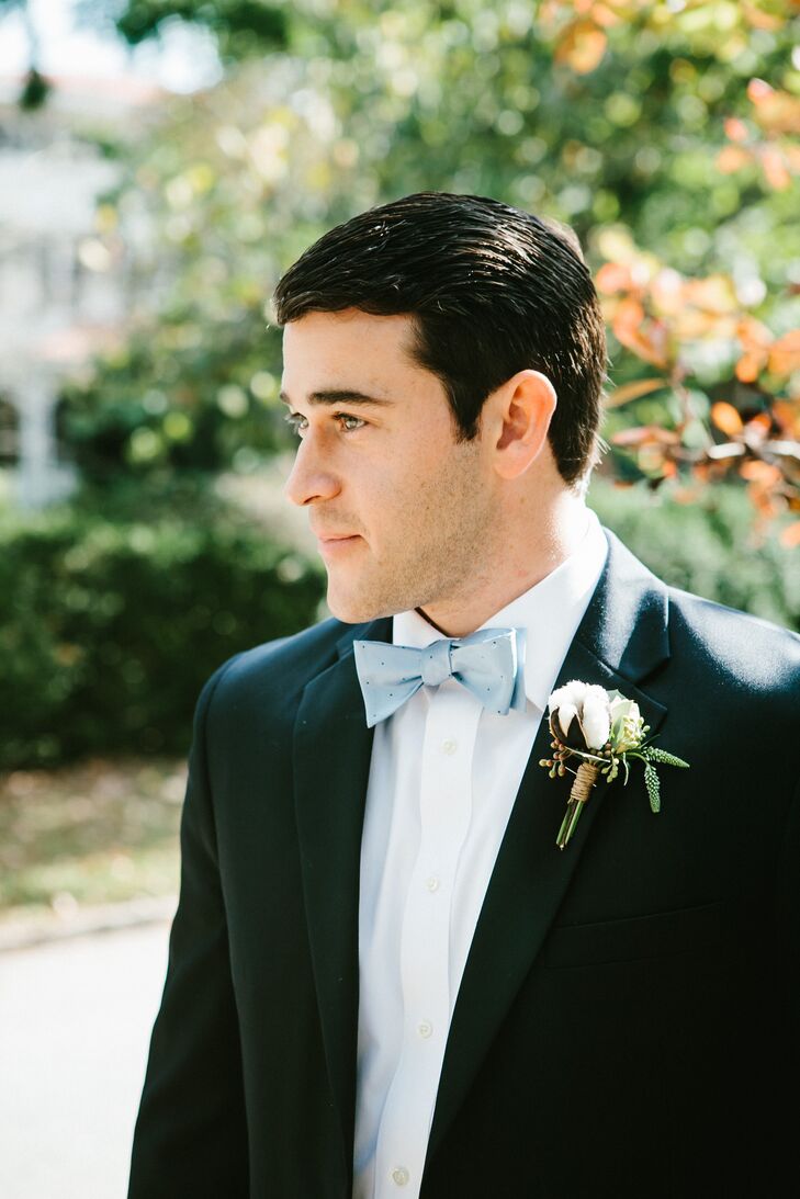 Jonathan and his groomsmen wore navy suits with custom bow ties from Jonathan's company, Brier and Moss. For some southern flair, they wore boutonnieres consisting of cotton bolls and greens.