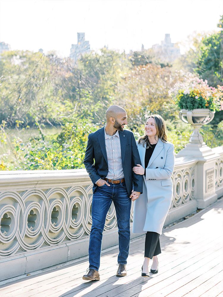 couple walking over bridge in New York Central Park
